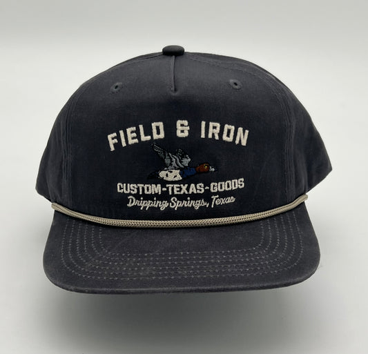 Black cap with 'Field & Iron' branding on a navy background